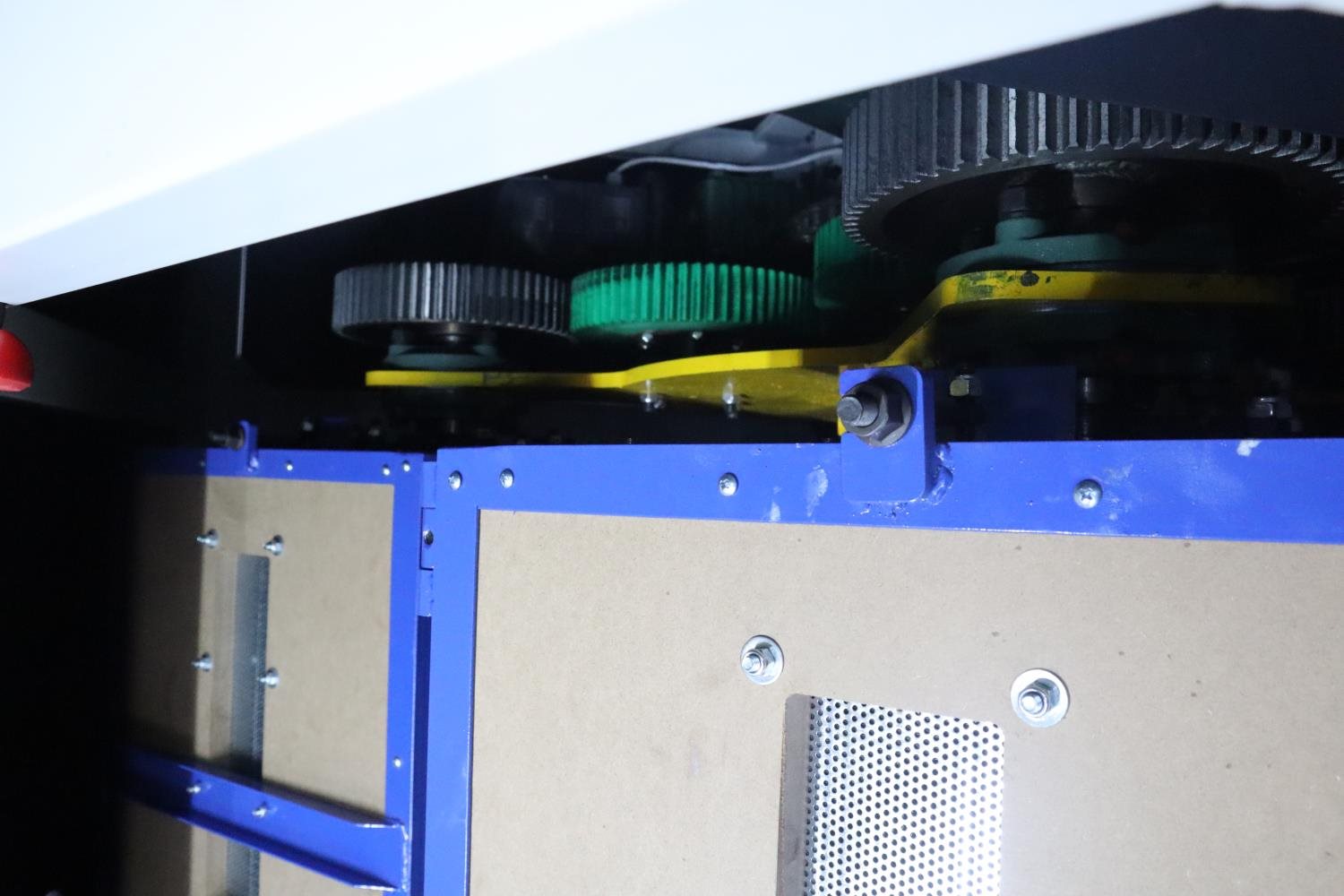 Drive gears inside industrial polishing equipment for maintenance inspection